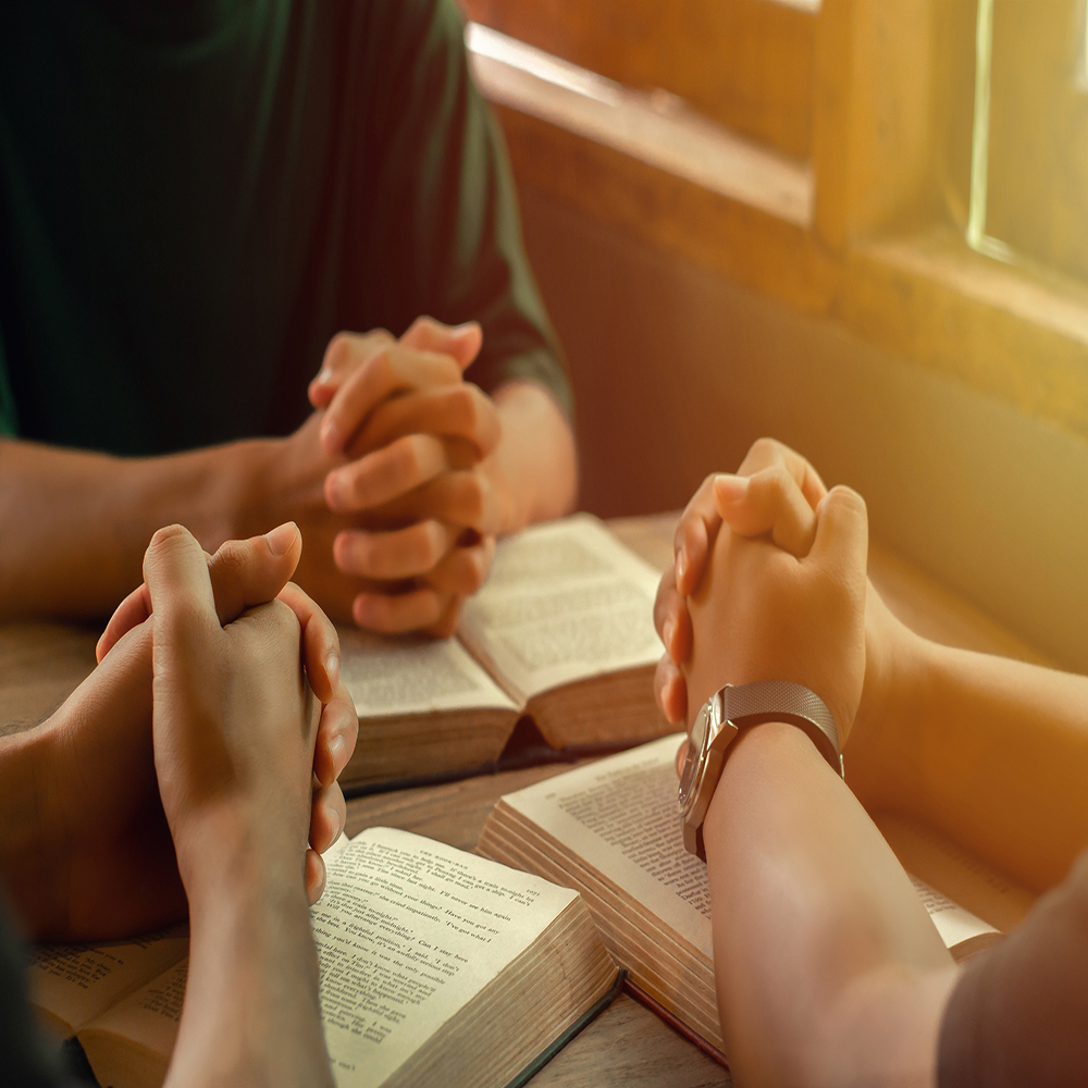 Christians join a group of cells that come together to pray and seek the blessings of God. with bible and share the gospel with copy space near the window sill in the morning